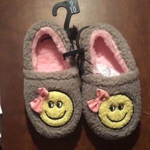 Smiley face slippers.